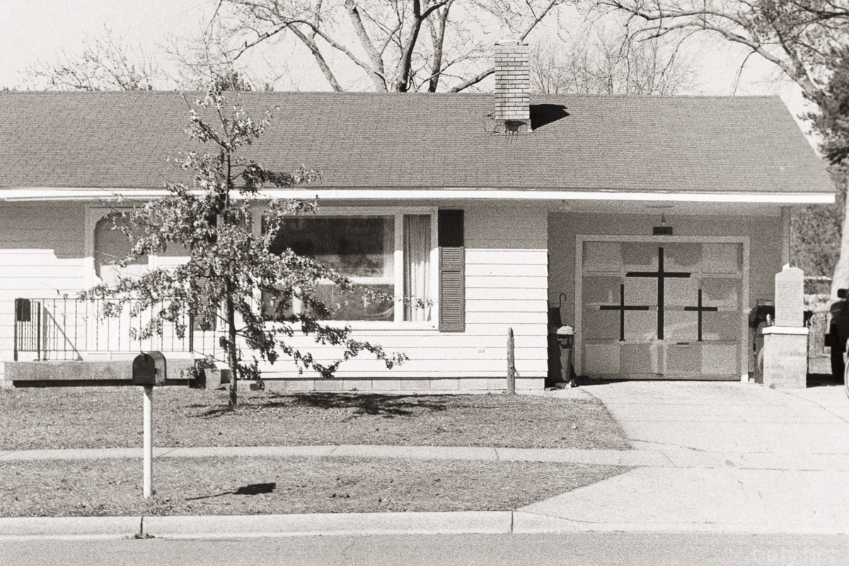 House with crosses painted on doors